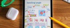 landing page, Close-up of tablet showing a hand-drawn landing page design, ideal for web development concepts.