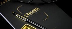 transformación empresarial exitosa, An elegant setup with a notebook, pen, and gold bar, embodying luxury and style.
