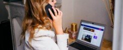 seguimiento comercial efectivo, a woman sitting at a desk with a laptop and a phone